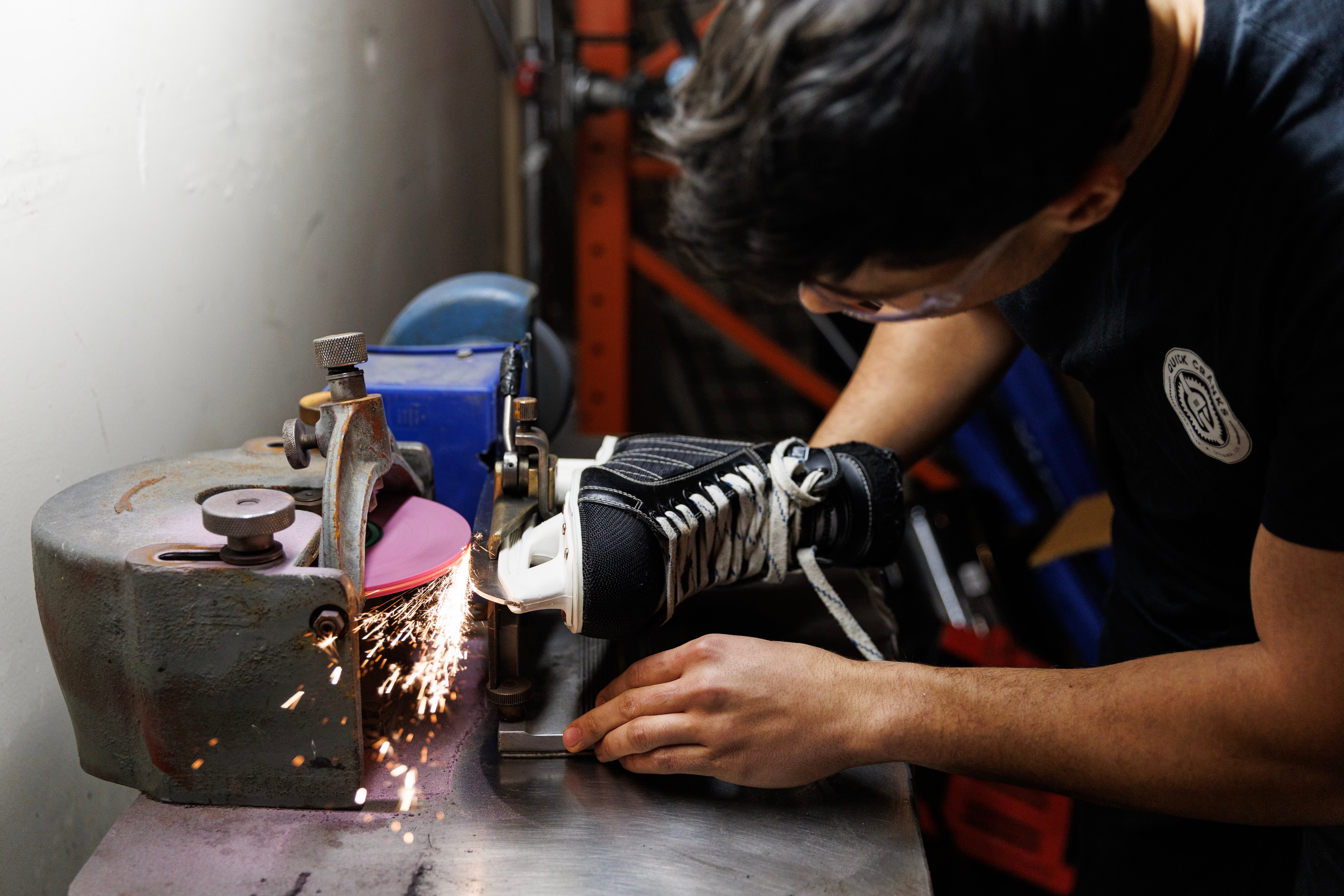 Person using a grinder sharpening skates in ottawa